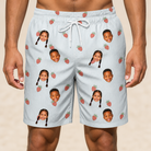 Model wearing Men's Berry Merry Custom Face Beach Shorts printed with kids' faces
