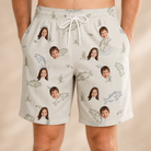 Model wearing Men's Bass Bash Custom Face Beach Shorts printed with kids' faces
