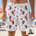 Man wearing Men's Bobber Bop Custom Face Beach Shorts — custom faces printed all-over