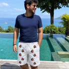 Real-life photo of someone wearing Men's Swing Symphony Custom Face Beach Shorts — custom faces printed all-over