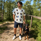 Full-length photo with the pet printed all over this Men's Tail Tales Custom Dog Face Polo Shirt