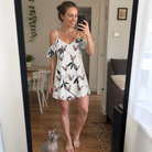 Full-length photo with the pet printed all over this Women's Clawful Feathers Custom Cat Face Off-Shoulder Dress