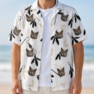 Man wearing Men's Clawful Feathers Custom Cat Face Hawaiian Shirt open over a white tee