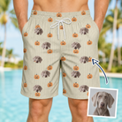 Man wearing Men's Fiery Fiends Custom Dog Face Beach Shorts — custom faces printed all-over