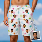 Man wearing Men's Sticky Situation Custom Face Beach Shorts — custom faces printed all-over