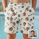 Man wearing Men's Skeleton Shenanigans Custom Face Beach Shorts — custom faces printed all-over