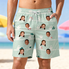 Model wearing Men's Ghostly Goofballs Custom Face Beach Shorts printed with kids' faces