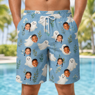 Model wearing Men's Wisp Whimsy Custom Face Beach Shorts printed with kids' faces