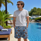 Real-life photo of someone wearing Men's Epitaph Escapades Custom Face Beach Shorts — custom faces printed all-over