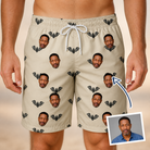Man wearing Men's Winged Whispers Custom Face Beach Shorts — custom faces printed all-over