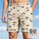 Man wearing Men's Winged Whispers Custom Cat Face Beach Shorts — custom faces printed all-over
