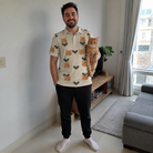 Full-length photo with the pet printed all over this Men's Winged Whispers Custom Cat Face Polo Shirt