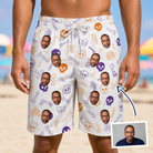 Man wearing Men's Humerus Humor Custom Face Beach Shorts — custom faces printed all-over