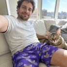 Selfie with the pet whose face is printed all over this Men's Leggy Lurkers Custom Cat Face Beach Shorts