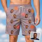 Man wearing Men's Silken Scare Custom Face Beach Shorts — custom faces printed all-over