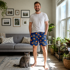 Full-length photo with the pet printed all over this Men's Orange Oddities Custom Cat Face Beach Shorts