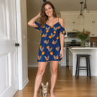 Full-length photo with the pet printed all over this Women's Orange Oddities Custom Cat Face Off-Shoulder Dress