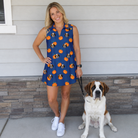 Full-length photo with the pet printed all over this Women's Orange Oddities Custom Dog Face V-Neck Dress