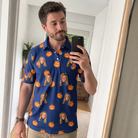 Real-life photo of someone wearing Men's Orange Oddities Custom Face Polo Shirt — custom faces printed all-over