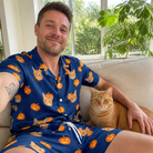 Selfie with the pet whose face is printed all over this Men's Orange Oddities Custom Cat Face Shirt & Shorts Set