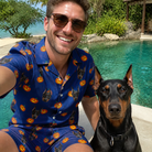 Selfie with the pet whose face is printed all over this Men's Orange Oddities Custom Dog Face Shirt & Shorts Set