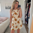 Real-life photo of someone wearing Women's Ember Eyes Custom Face Tank Dress — custom faces printed all-over