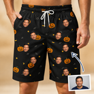 Man wearing Men's Cackle Carvings Custom Face Beach Shorts — custom faces printed all-over