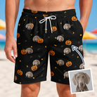 Man wearing Men's Cackle Carvings Custom Dog Face Beach Shorts — custom faces printed all-over