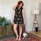 Full-length photo with the pet printed all over this Women's Cackle Carvings Custom Cat Face V-Neck Dress