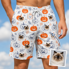 Man wearing Men's Jack O'Jitters Custom Cat Face Beach Shorts — custom faces printed all-over