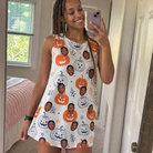 Real-life photo of someone wearing Women's Jack O'Jitters Custom Face Tank Dress — custom faces printed all-over