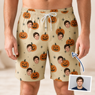 Man wearing Men's Gourd Grins Custom Face Beach Shorts — custom faces printed all-over