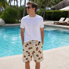 Real-life photo of someone wearing Men's Lantern Laughs Custom Face Beach Shorts — custom faces printed all-over