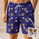 Man wearing Men's Bone Appétit Custom Dog Face Beach Shorts — custom faces printed all-over