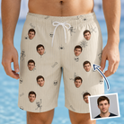 Man wearing Men's Arachnid Antics Custom Face Beach Shorts — custom faces printed all-over
