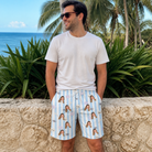 Real-life photo of someone wearing Men's Graveyard Giggles Custom Face Beach Shorts — custom faces printed all-over