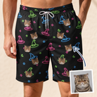 Man wearing Men's Moonlit Millinery Custom Cat Face Beach Shorts — custom faces printed all-over