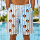 Model wearing Men's Wicked Peaks Custom Face Beach Shorts printed with kids' faces