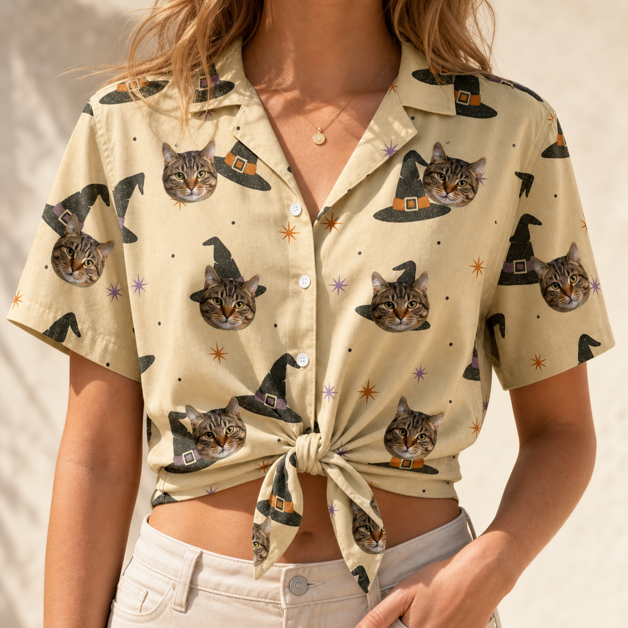 Woman wearing Women's Spellbound Spires Custom Cat Face Hawaiian Shirt tied at the waist