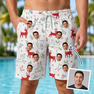 Man wearing Men's Rudolph Ruckus Custom Face Beach Shorts — custom faces printed all-over