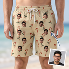 Man wearing Men's Minty Mistletoe Custom Face Beach Shorts — custom faces printed all-over