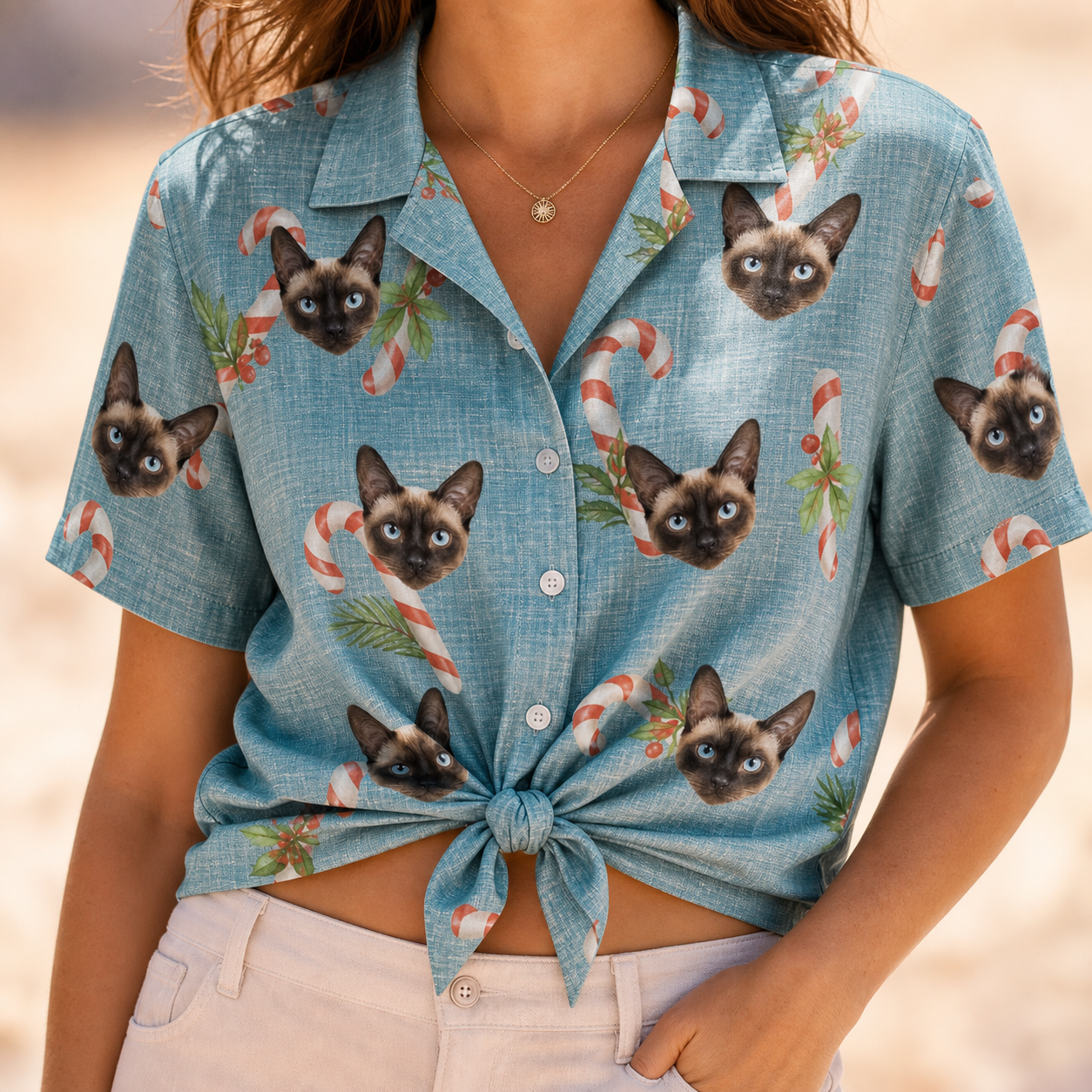 Woman wearing Women's Cane Carousel Custom Cat Face Hawaiian Shirt tied at the waist