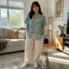 Full-length photo with the pet printed all over this Women's Cane Carousel Custom Cat Face Hawaiian Shirt