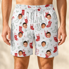 Model wearing Men's Yule Pouches Custom Face Beach Shorts printed with kids' faces