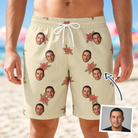 Man wearing Men's Poinsettia Pop Custom Face Beach Shorts — custom faces printed all-over