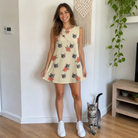 Full-length photo with the pet printed all over this Women's Poinsettia Pop Custom Cat Face Tank Dress