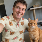 Selfie with the pet whose face is printed all over this Men's Poinsettia Pop Custom Cat Face Polo Shirt