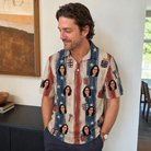 Real-life photo of someone wearing Men's Wrapped Wonders Custom Face Polo Shirt — custom faces printed all-over