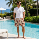 Real-life photo of someone wearing Men's Jolly Jingle Custom Face Beach Shorts — custom faces printed all-over