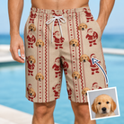 Man wearing Men's Jolly Jingle Custom Dog Face Beach Shorts — custom faces printed all-over